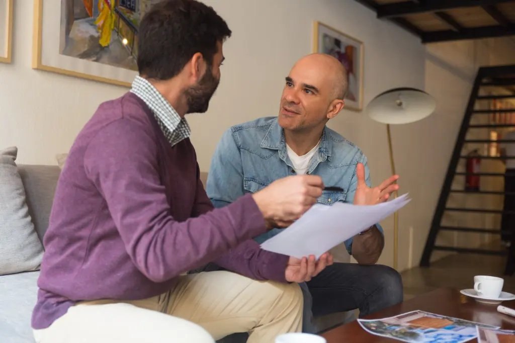 Two adults reviewing documents together during a consultation