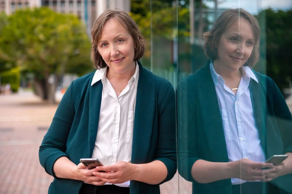Dr. Jessica Myszak, Licensed Psychologist at Help and Healing Center, smiling professionally in an outdoor setting