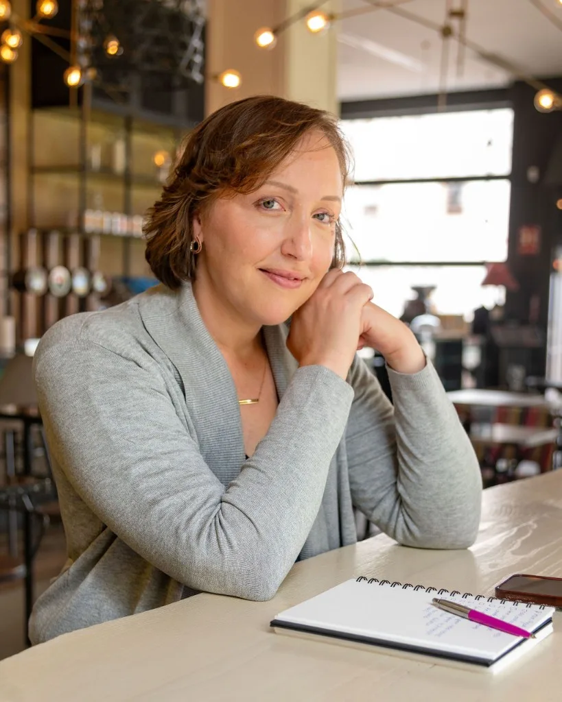 Dr. Jessica Myszak, Licensed Psychologist at Help and Healing Center, smiling in a professional setting